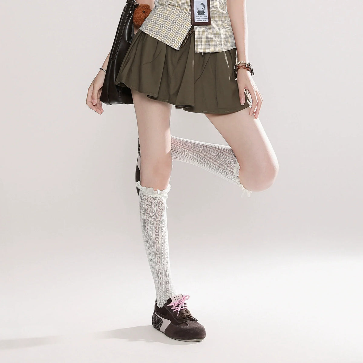 Plaid Sleeveless Button-Up Shirt with Brown Pleated Skirt